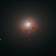 Illustration for article titled This Entire Galaxy Is Being Ravaged by Its Supermassive Black Hole